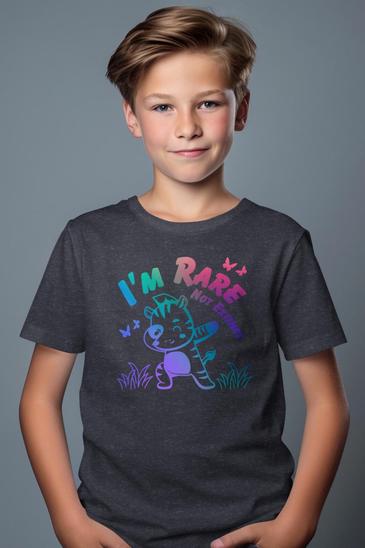 a young boy wearing a t - shirt that says i'm rare